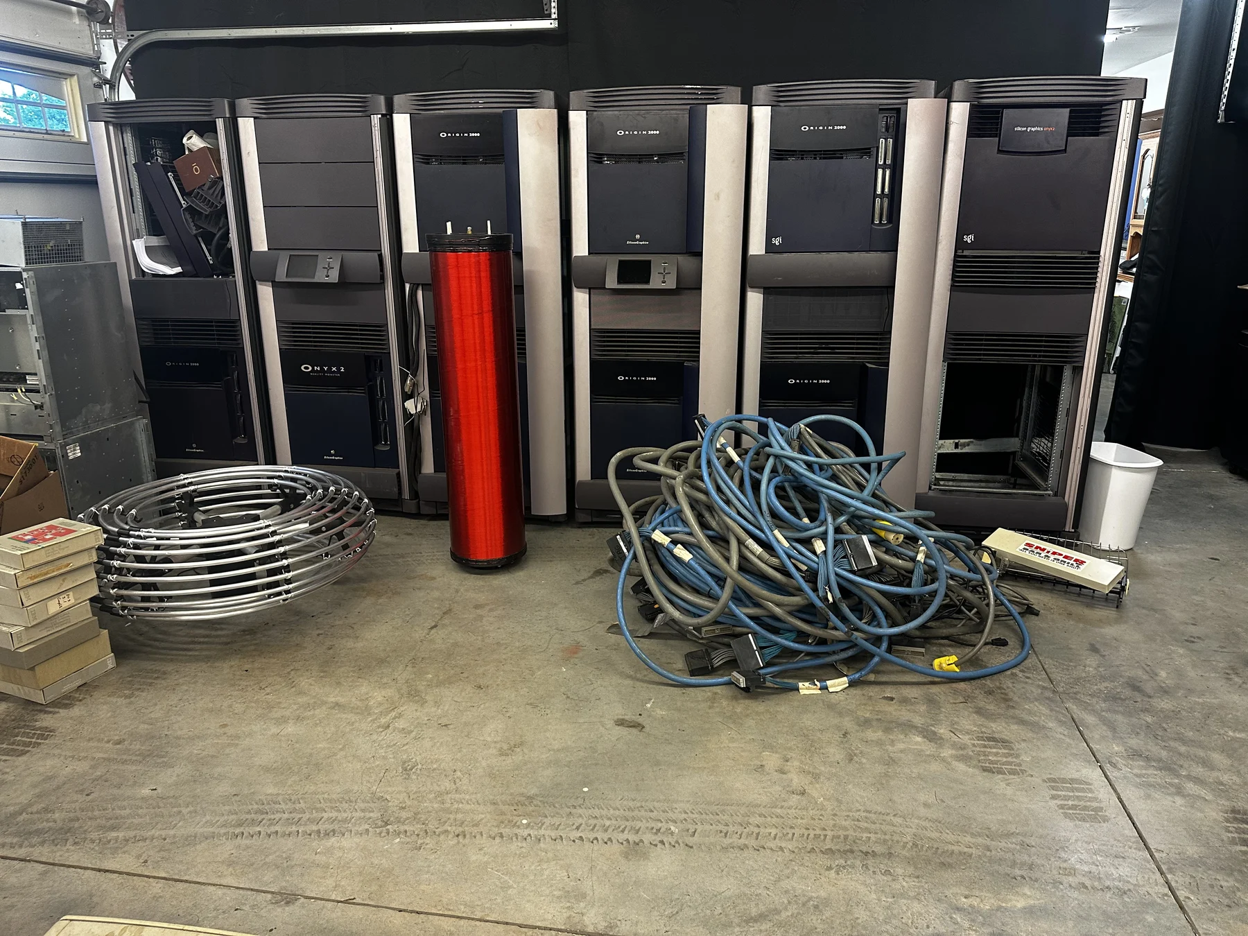 SGI Origin 2000 and Onyx2 cabinets with cables and parts after the system was received.